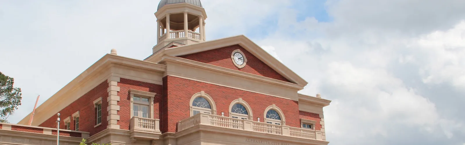 Brick civic building with a clock tower in Alpharetta, GA