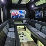 Black Panther party bus seating and TVs