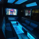Black Panther party bus interior with blue lighting